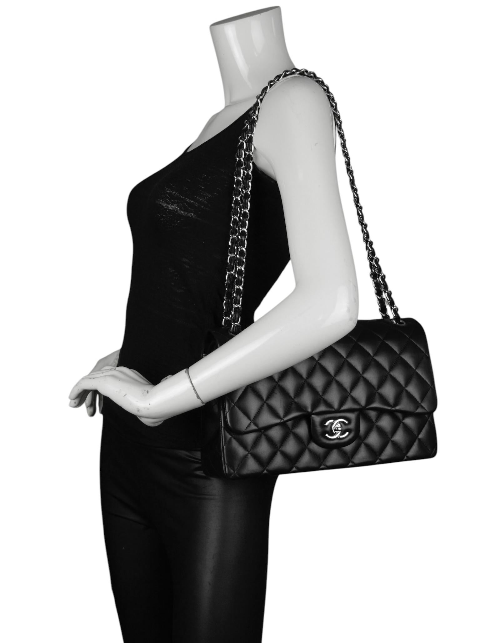 Chanel Black Lambskin Leather Quilted Classic Double Flap Jumbo Bag with Silver Hardware 

Made In: France
Color: Black 
Hardware: Silvertone
Materials: Lambskin Leather
Lining: Leather
Closure/Opening: Top flap with CC turnlock
Exterior Pockets: