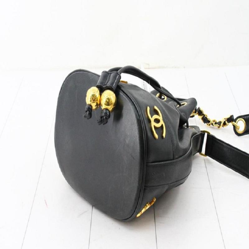 Chanel Black Lambskin Leather Triple CC Logo Drawstring Bucket Bag In Good Condition In Irvine, CA