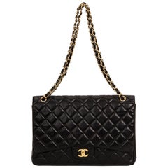 Chanel - Sac à main à rabat en cuir d'agneau noir