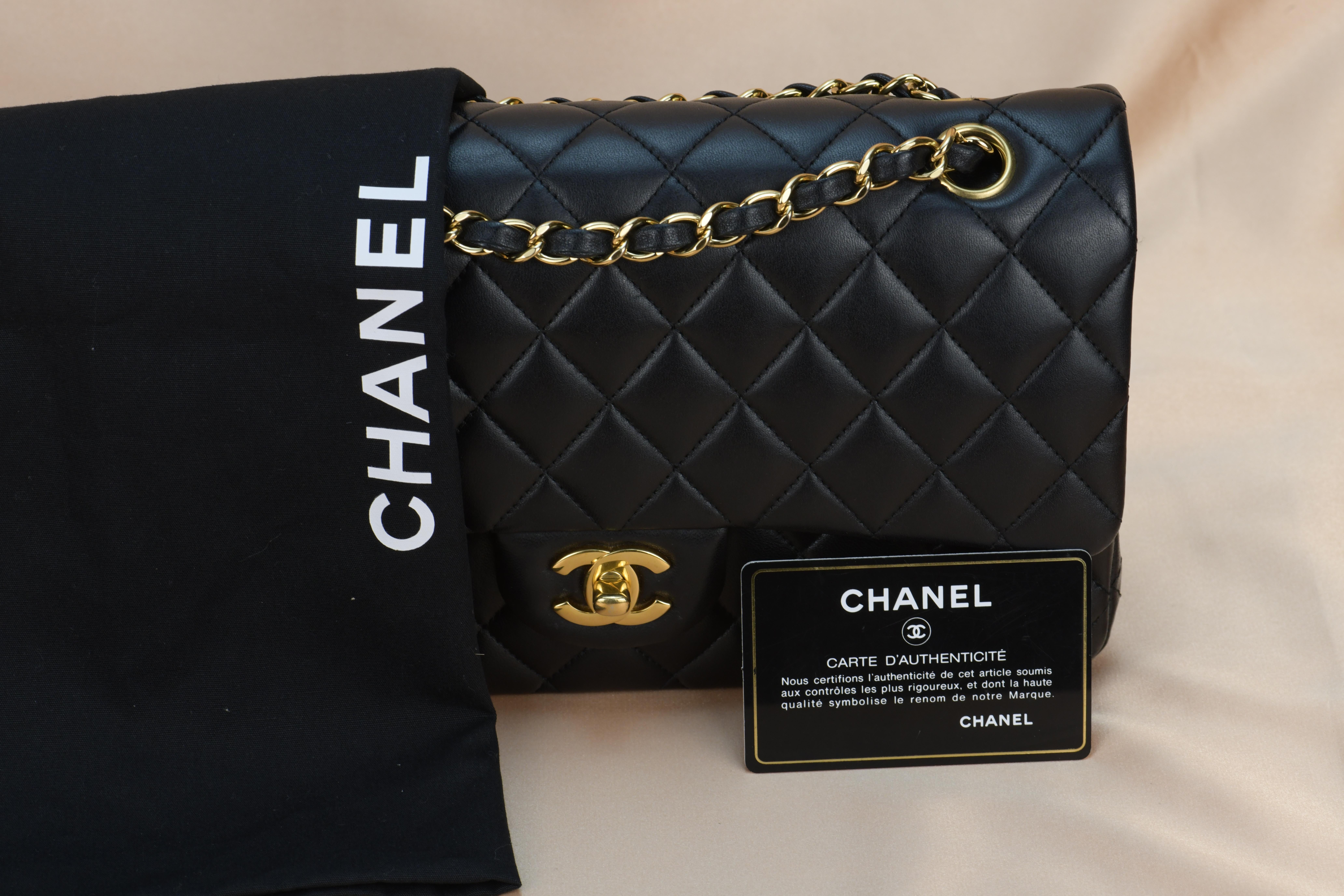 Dandelion Code	AT-1203
Brand	Chanel
Model	Timeless Classic Double Flap 
Serial No.	21******
Color	Black
Date	Approx. 2015-2016
Metal	Gold
Material	Lambskin Leather
Measurements	Approx. 10in L x 2.5in W x 6.5in H
Condition	Excellent 
Comes