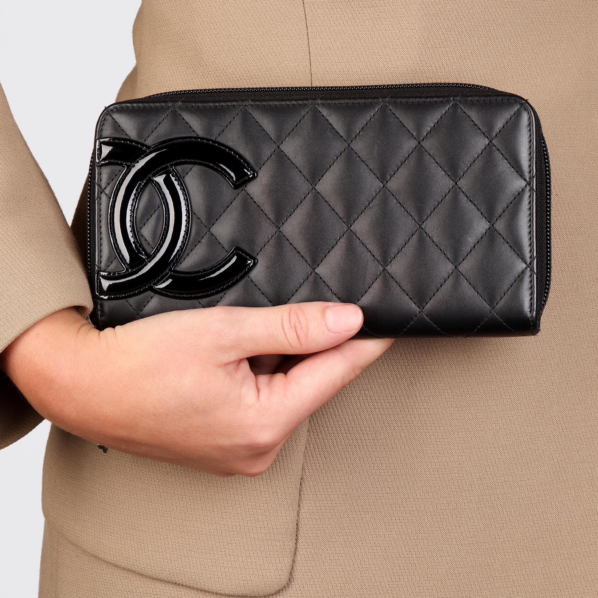 BRAND	Chanel
MODEL	Ligne Cambon Long Wallet
AGE	2016
GENDER	Women's
MATERIAL(S)	Lambskin Leather
COLOUR	Black
HARDWARE	Silver
INTERIOR	Pink Textile
HEIGHT	11cm
WIDTH	19.3cm
DEPTH	2.5cm
AUTHENTICITY DETAILS	Serial Sticker (Made in Spain)