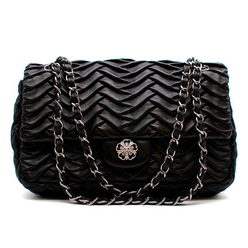 Chanel Black Lambskin Pleated Leather Single Flap Bag

One of the most desirable bags in the world the Chanel flap style is a super versatile design that can be worn with any look and cherished for years. 
This item is extra special thanks to its