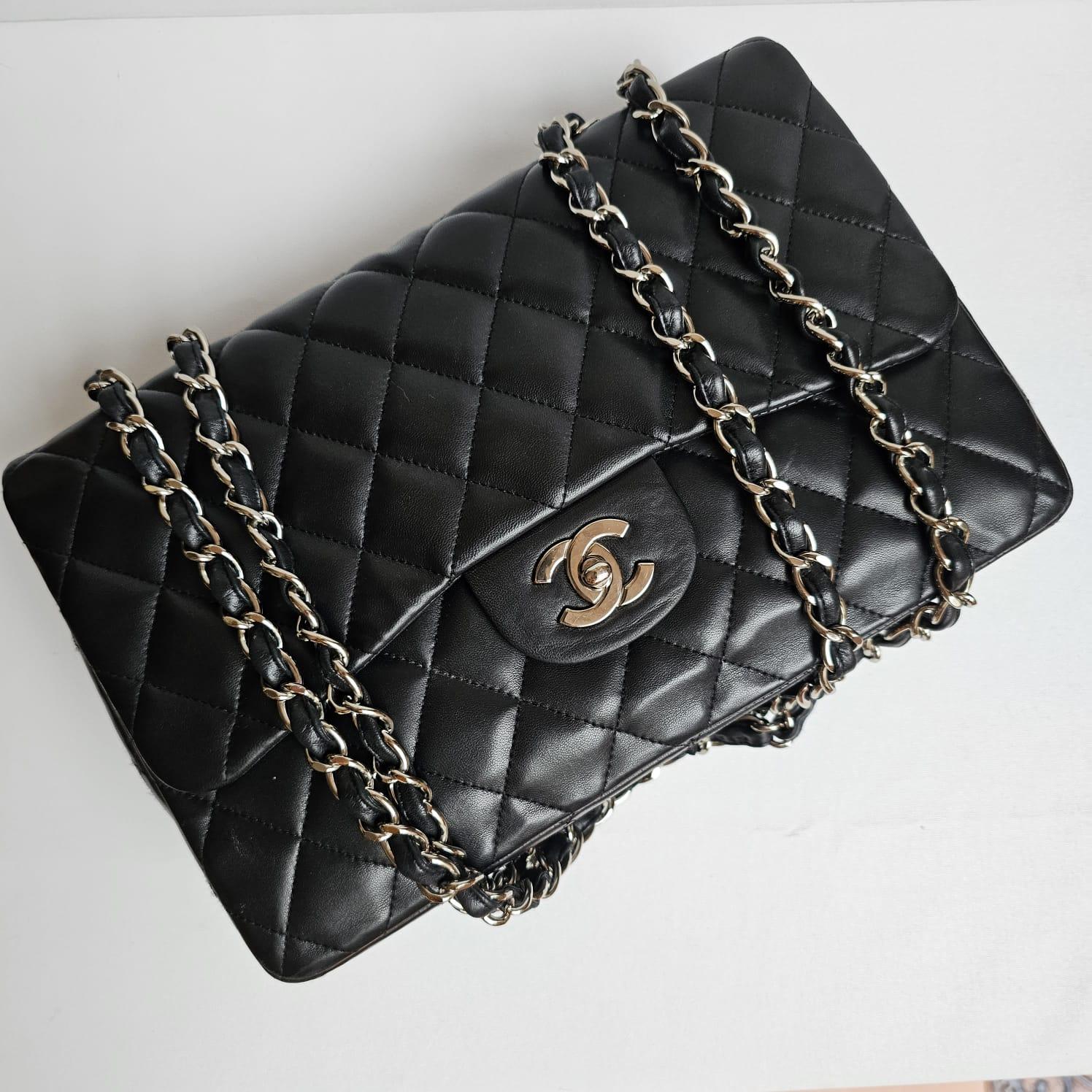 Women's or Men's Chanel Black Lambskin Quilted Jumbo Single Flap Bag For Sale