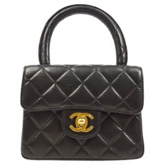 CHANEL Black Lambskin Quilted Leather Micro Mini Kelly Top Handle Party Flap Bag