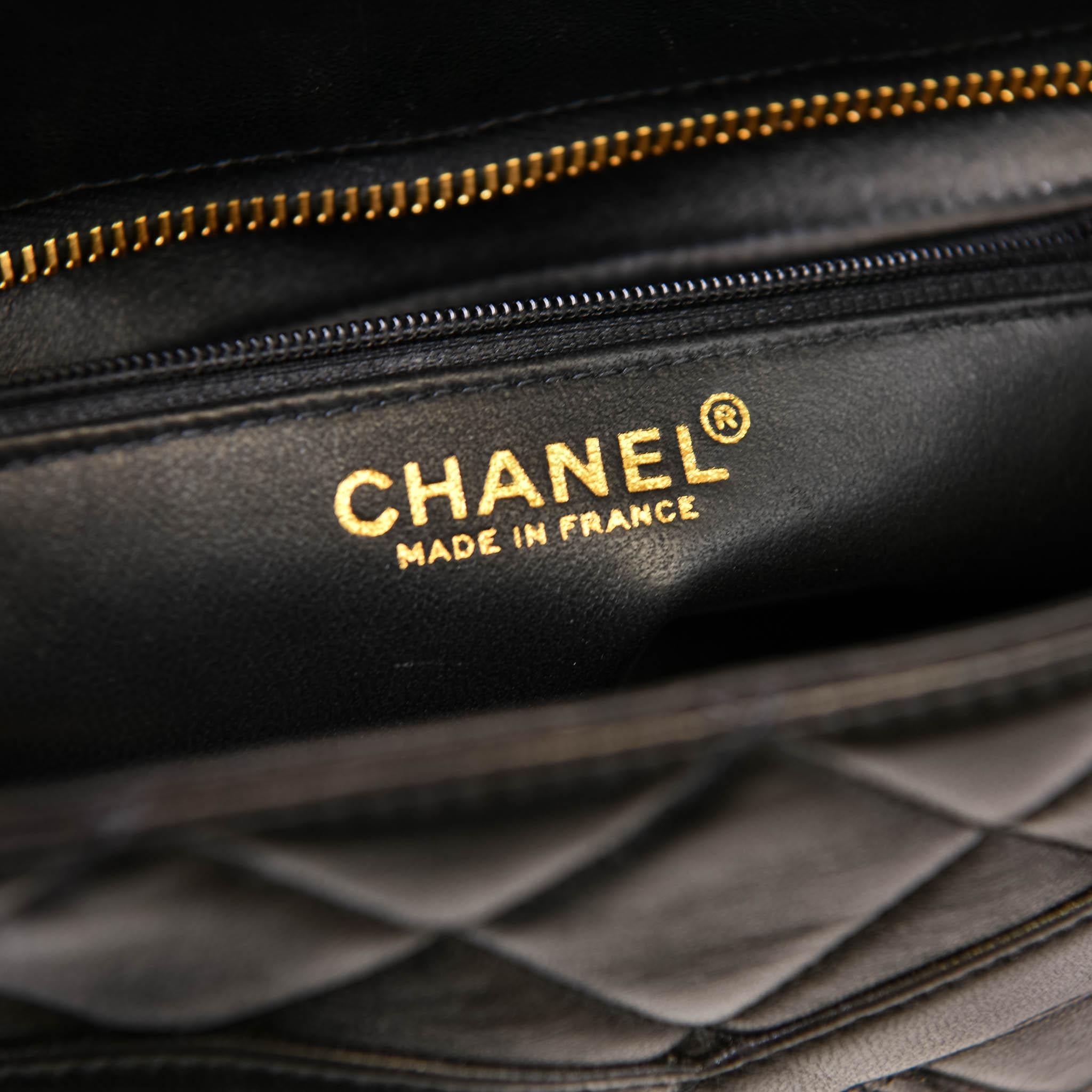 Chanel Black Lambskin Quilted Medallion Tote Gold Hardware
100% Authentic 

 This stylish tote is beautifully crafted of diamond-quilted lambskin leather in black with a prominent Chanel CC logo patch on the front. The bag features a rear patch