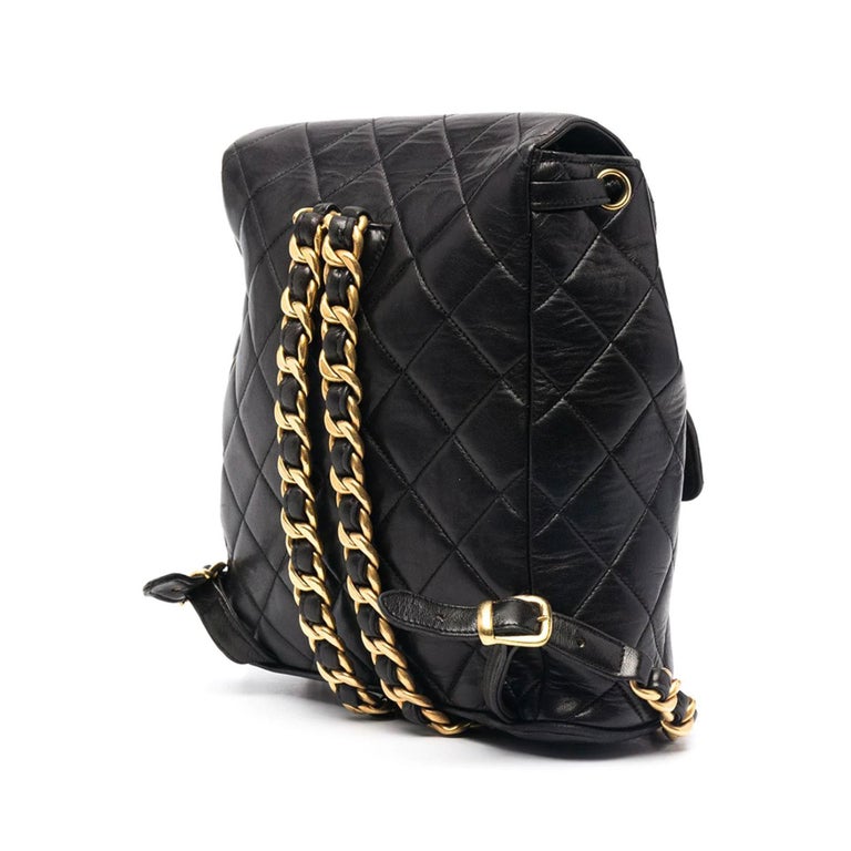 Chanel Black quilted lambskin backpack with interwoven chain straps

1994 {VINTAGE 28 Years}
Gold hardware
Double CC turnlock closure
Small front pocket
Interior black lambskin lining
Drawstring bucket closure
Adjustable straps
Flat bottom with CC