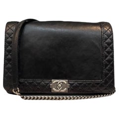 CHANEL Black Lambskin Reverso Boy Medium Flap Bag