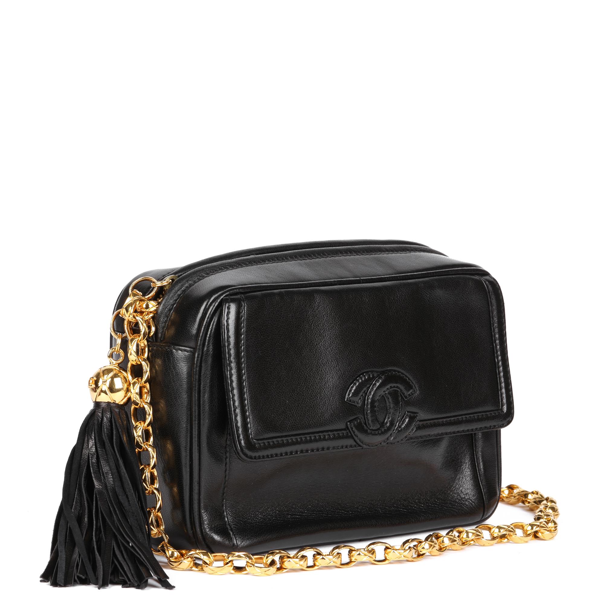 CHANEL
Black Lambskin Vintage Mini Fringe Camera Bag

Serial Number: 1992
Age (Circa): 1992
Accompanied By: Chanel Dust Bag, Authenticity Card
Authenticity Details: Authenticity Card, Serial Sticker (Made in Italy)
Gender: Ladies
Type: Shoulder,