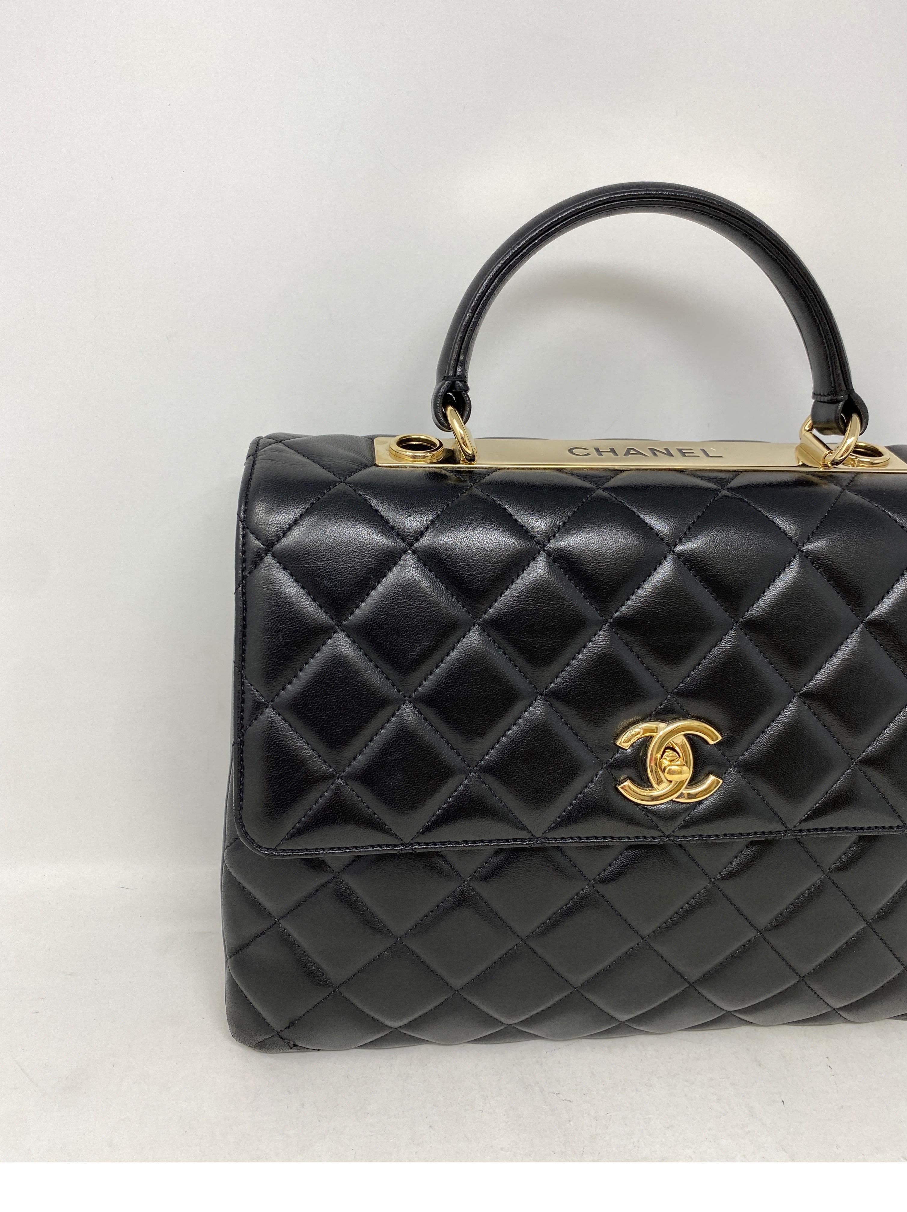 Chanel Black Large Trendy Bag. Gold hardware. Lambskin leather. Mint like new condition. Gorgeous Chanel bag. Has detachable chain strap. Can be worn as a top handle bag or as a shoulder bag. Gold plated hardware on top of bag. Unique look and a