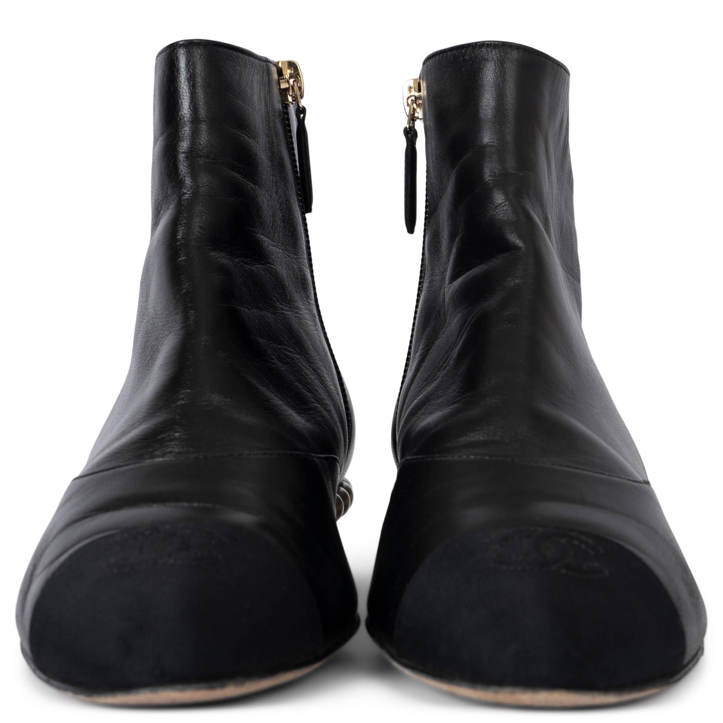 These 100% authentic Chanel Pearl Heel Ankle Boots are a luxurious addition to any wardrobe. Crafted from soft black lambskin leather, they feature a classic black grosgrain CC cap toe and stunning pearl detailing around the heel. With side zips and