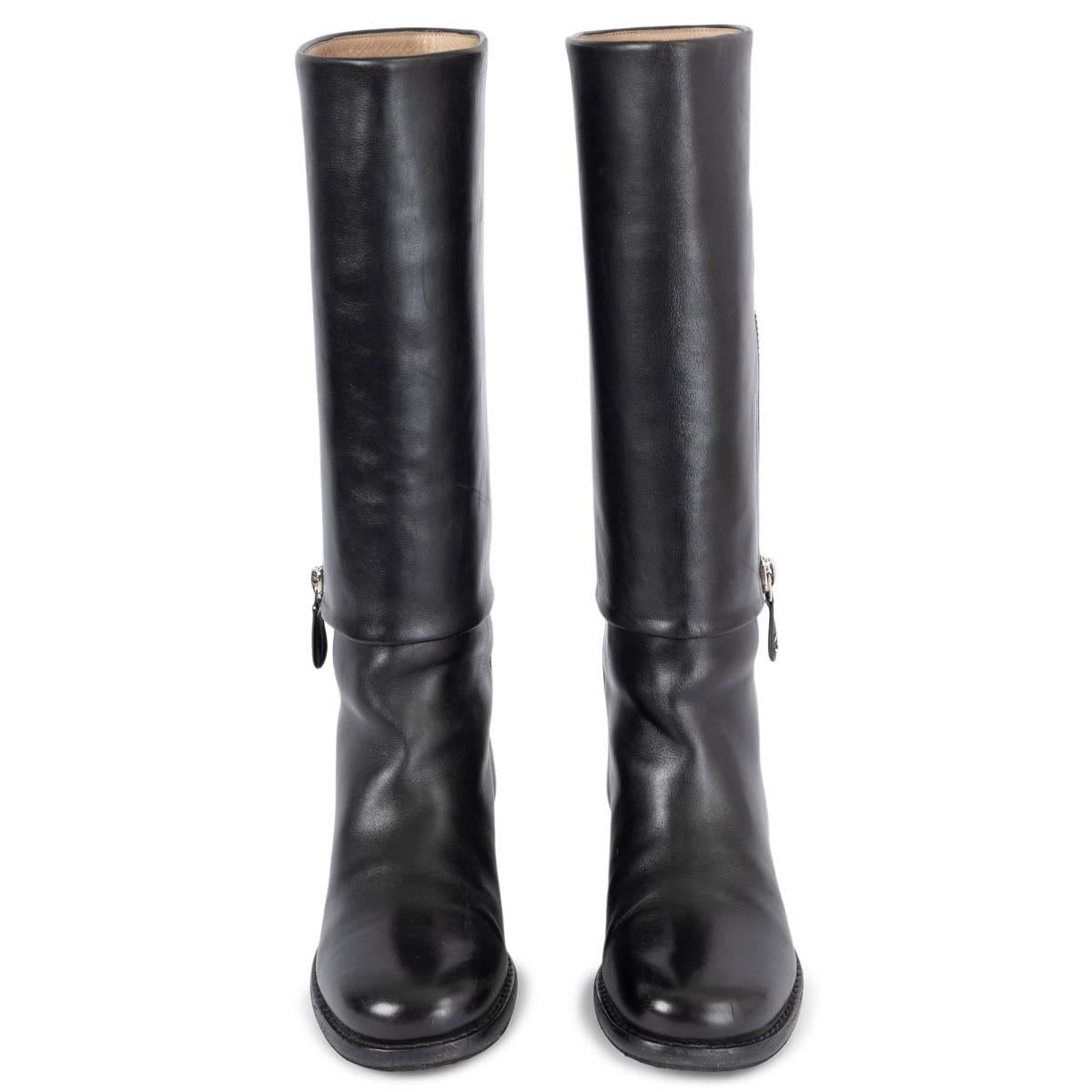 100% authentic Chanel riding boots in black smooth calfskin. The design features a silver-tone zipper detail on the side with CC logo pull tab. Have been worn and are in excellent condition. Rubber sole got added. 

2012 Paris-Bombay Metiers