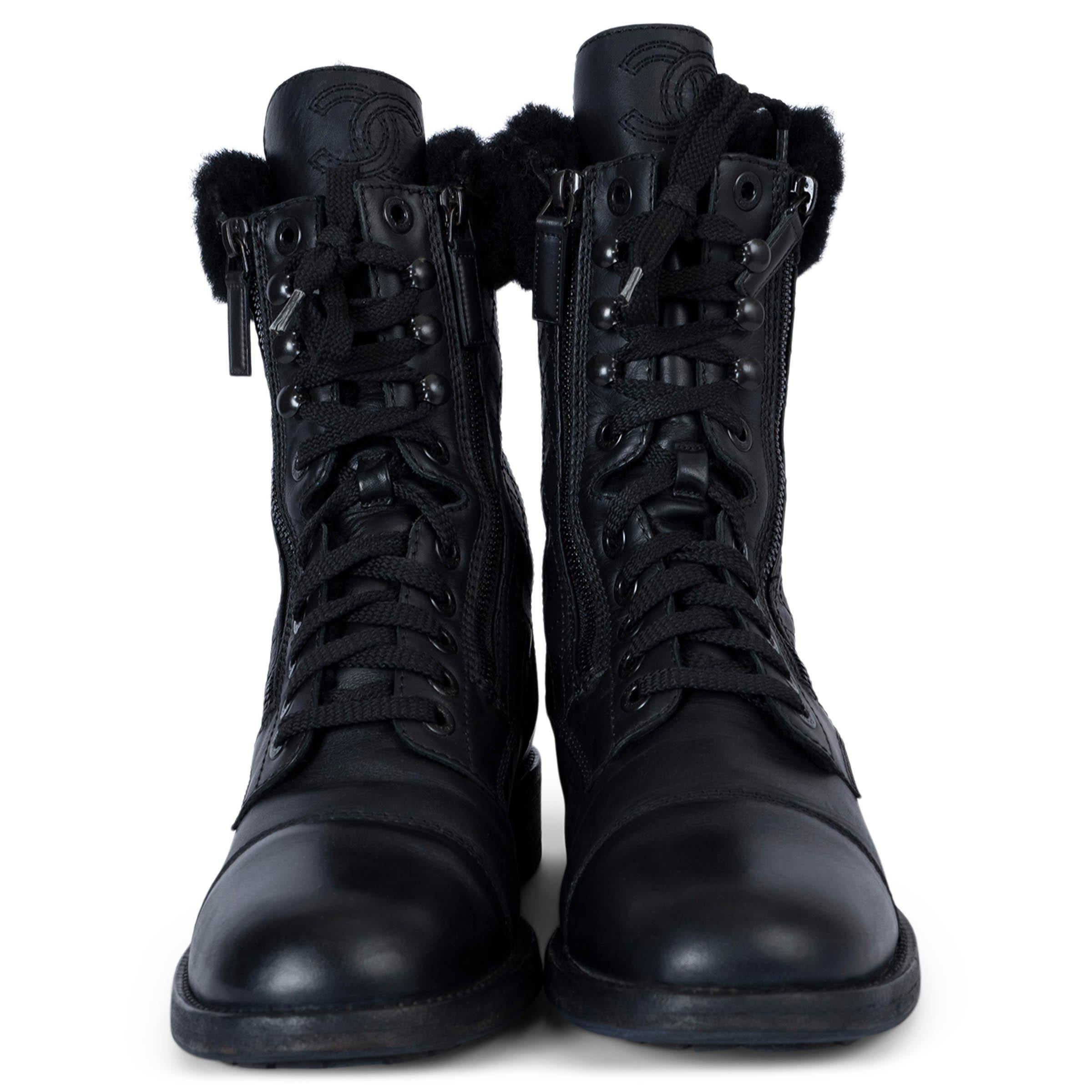100% authentic Chanel combat boots in black leather. Feature fur-trim around the ankles, quilting on the side panels, decorative lace-ups and low block heel. Open with a zipper on each side and are fully lined in shearling. Have been worn and are in