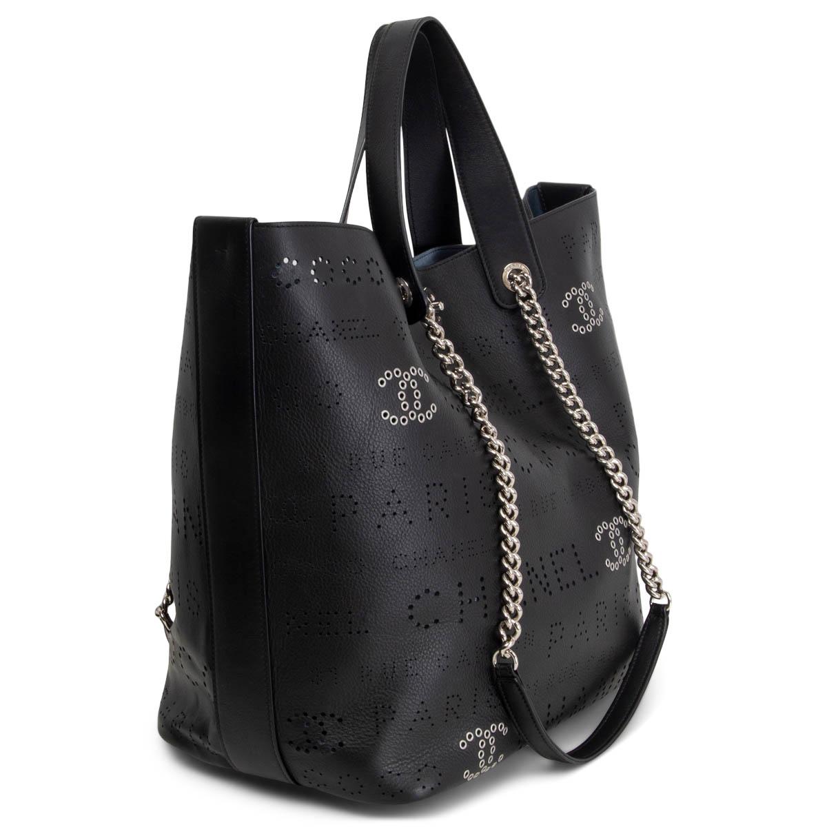 100% authentic Chanel 2019 Perforated Logo Eyelet Small Shopping Bag in black smooth calfskin embellished with CC silver-tone eyelet detailing and chain straps. Opens with a silver-tone CC turn-lock to a pale blue unlined interior with a blue, with