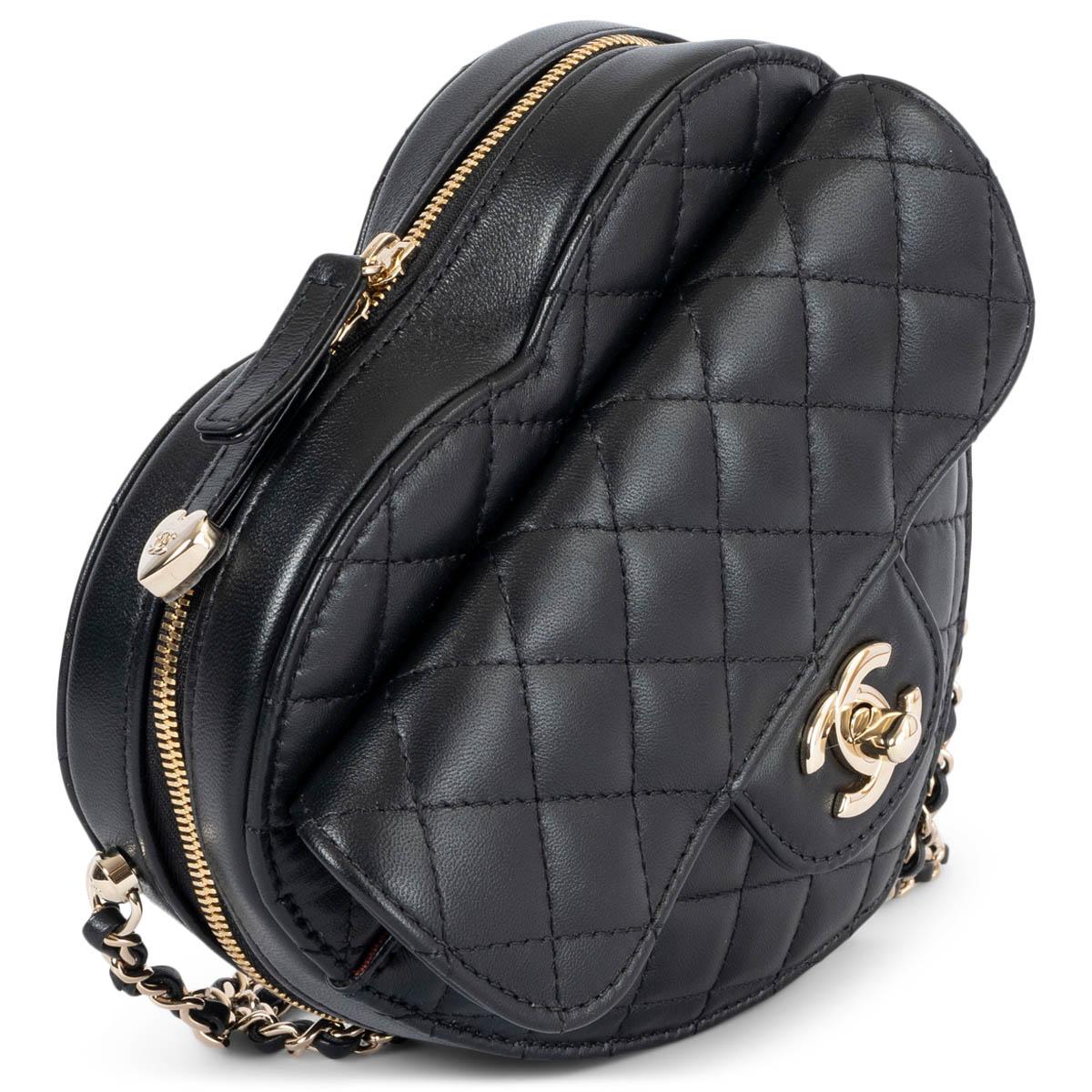 100% authentic Chanel Heart bag in black quilted leather with light gold-plated hardware. Features a flap pocket on the front with CC turn-lock, an open pocket on the back and classic chain strap. Closes with a zipper on top. Lined in burgundy