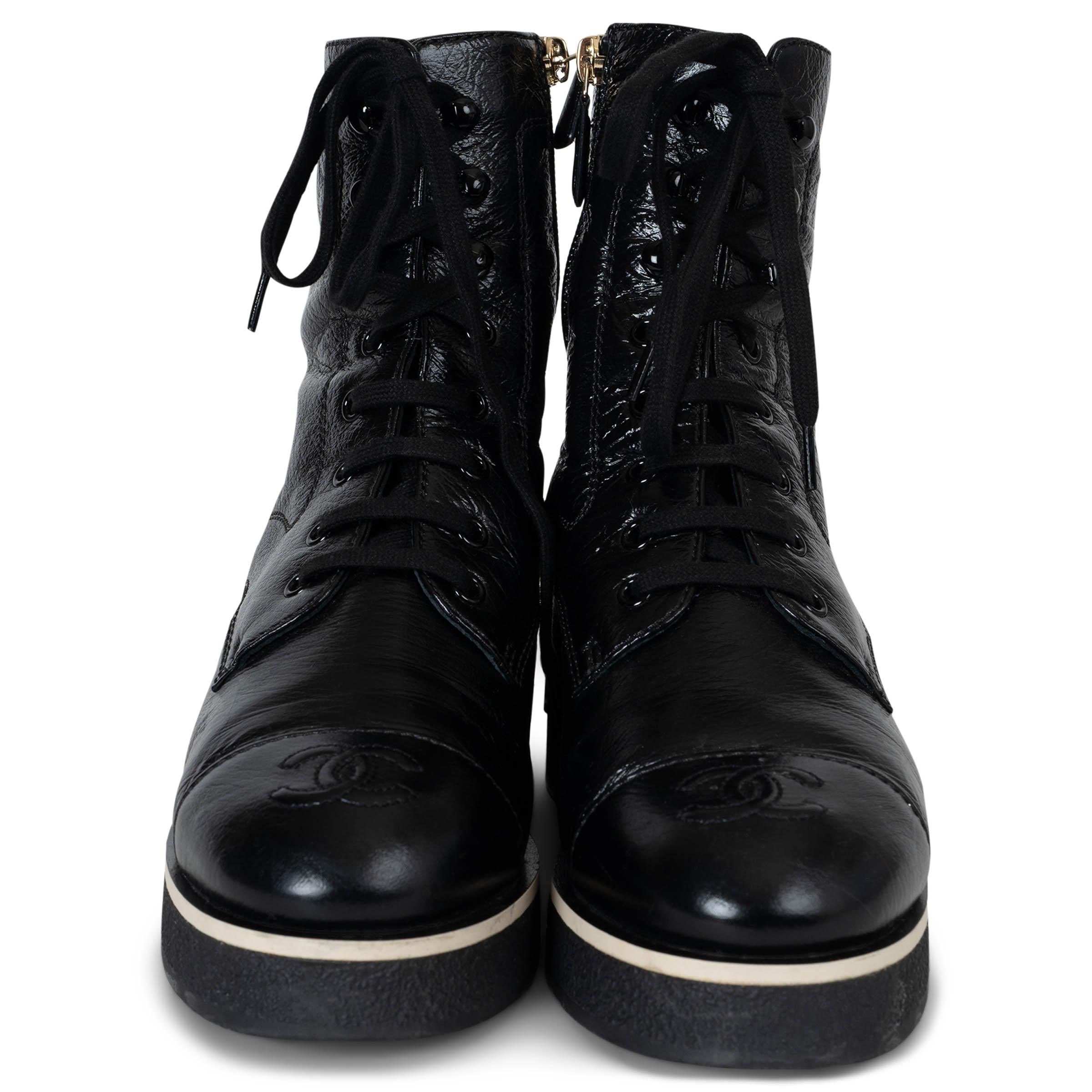 These 100% authentic Chanel boots in black shiny crumpled lambskin leather blend edgy sophistication with signature detailing. Designed with a round-toe silhouette and ankle-high shaft, they feature decorative laces for a bold aesthetic. The chunky