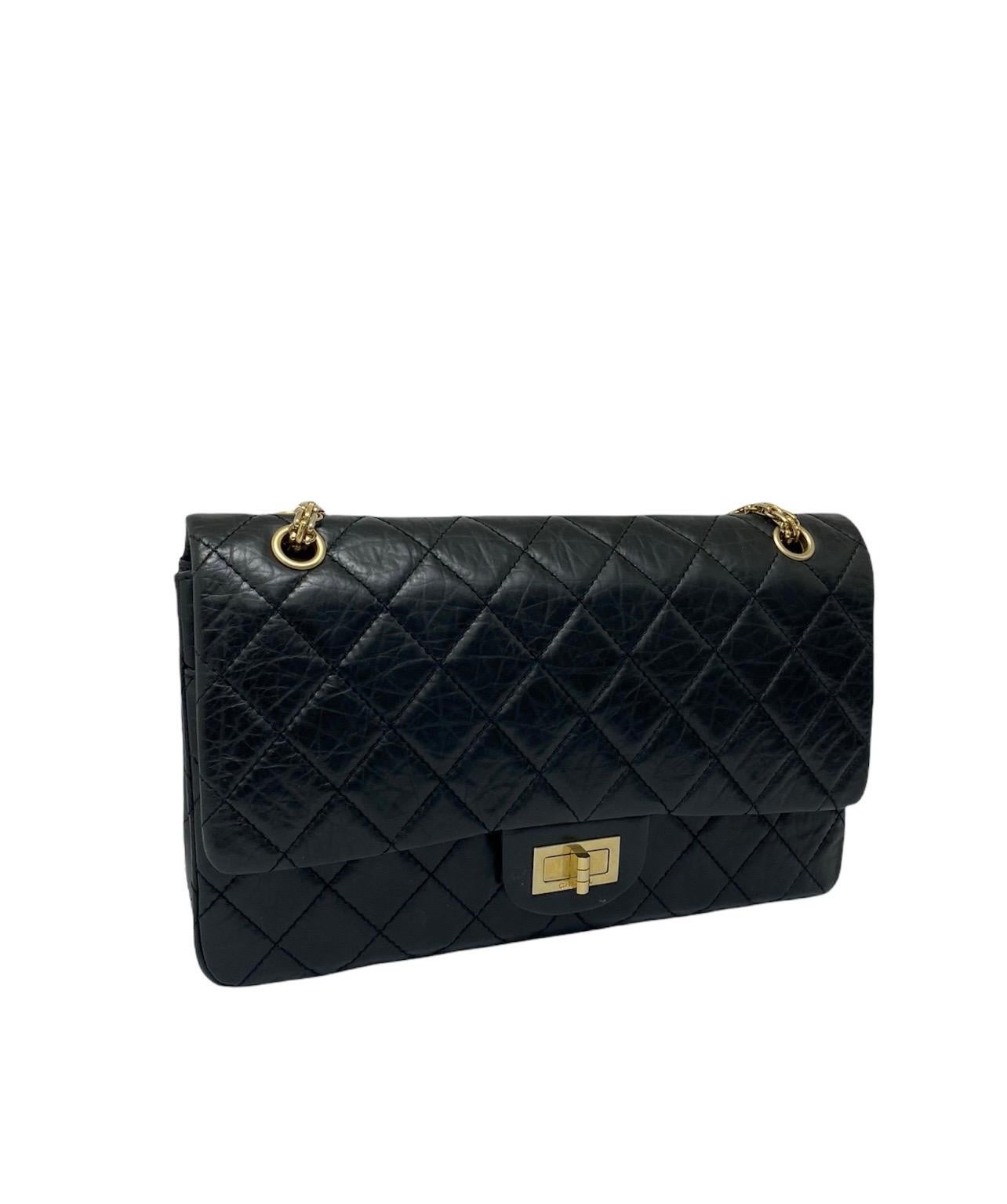 Chanel celebrates the 50th anniversary of the classic Chanel 2.55 bag with this beautiful edition in black quilted leather with gold hardware. Year of the scholarship 2005.  The bag is double flap with interlocking closure. The interior is lined