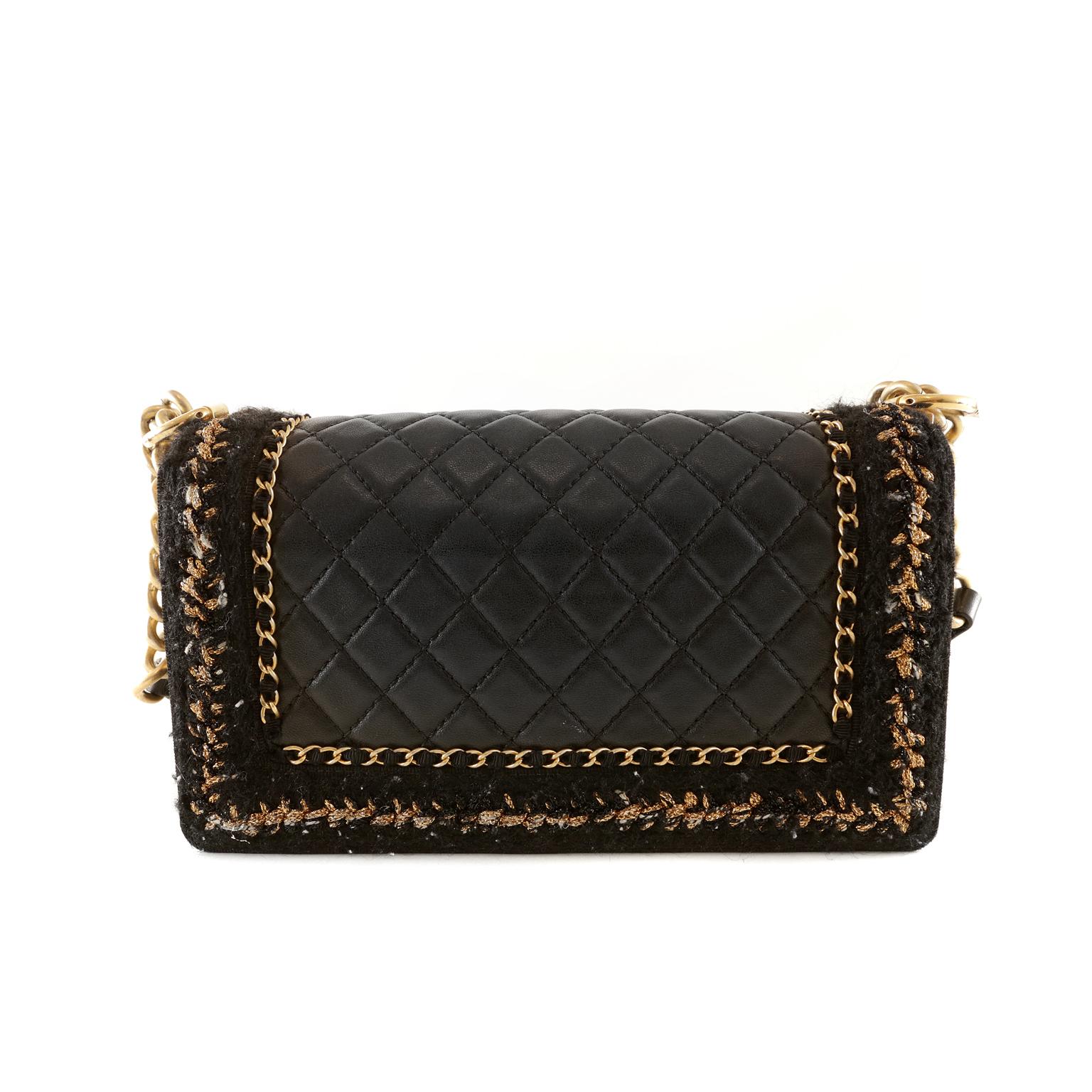 Chanel Black Boucle Chain Boy Bag- pristine; never before carried
The updated design is structured and edgy with a versatility that makes it extremely popular.  The Gold Chain version takes details a step further with elegant ribbon and chain