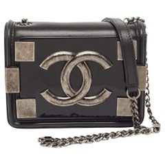 Chanel - Mini sac à bandoulière en cuir et plexiglas noir