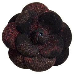 Chanel black leather and red sparkling Camelia brooch