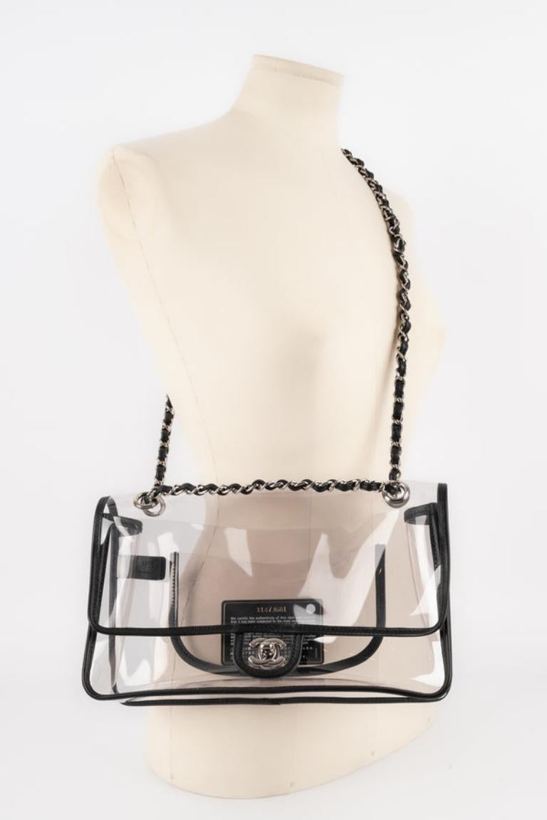 Chanel - (Made in France) Black leather and transparent PVC bag with silvery metal elements. 2007 Spring-Summer Ready-to-Wear Collection. Sold with an authenticity certificate. The serial number is 11473681.

Additional information: 
Condition: Very