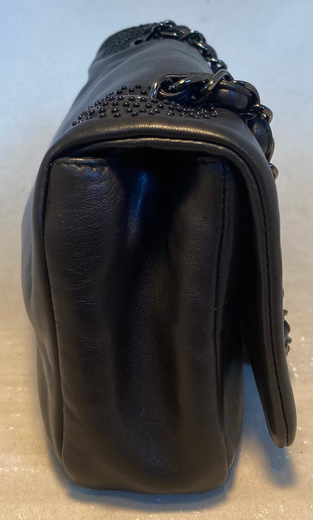 Chanel Black Leather Beaded CC Top Flap Classic Shoulder Bag in excellent condition. Soft black lambskin leather exterior trimmed with delicate black beaded CC logo along front top flap and around each end of shoulder strap. Woven gunmetal chain and