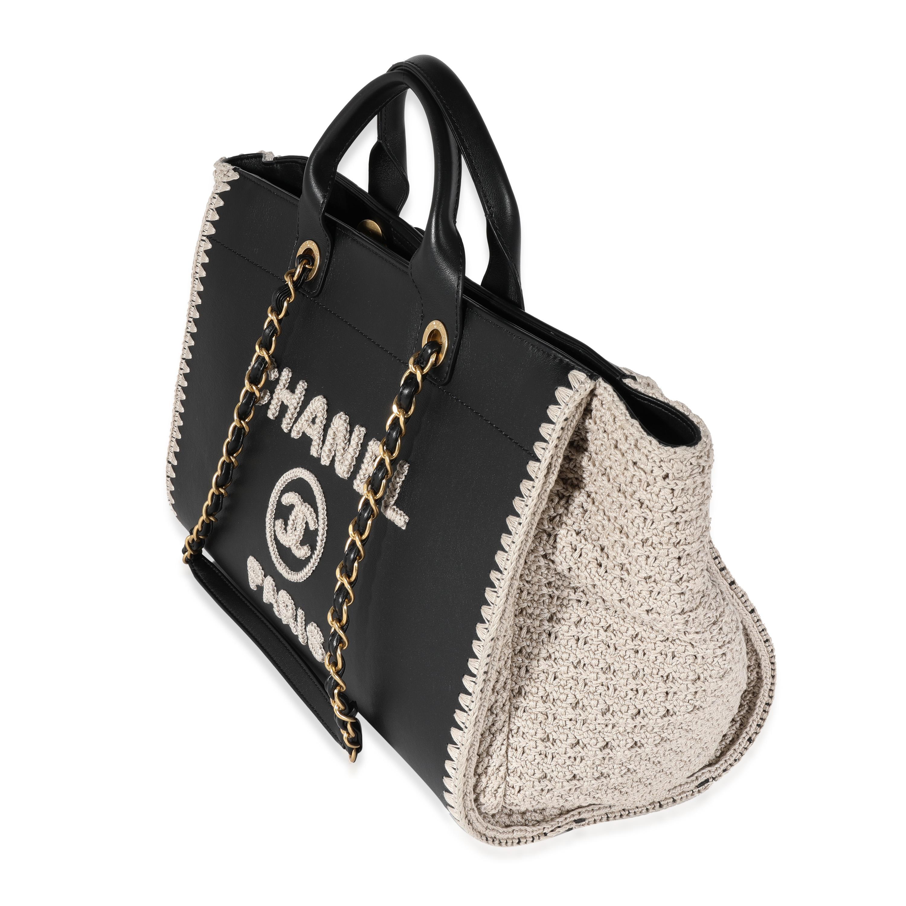 Listing Title: Chanel Black Leather & Beige Crochet Large Deauville Tote
SKU: 122056
Condition: Pre-owned 
Handbag Condition: Very Good
Condition Comments: Very Good Condition. Light scuffing to leather. Scratching and tarnishing to hardware. Light