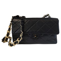 Chanel black leather black and white chain timeless shoulder bag