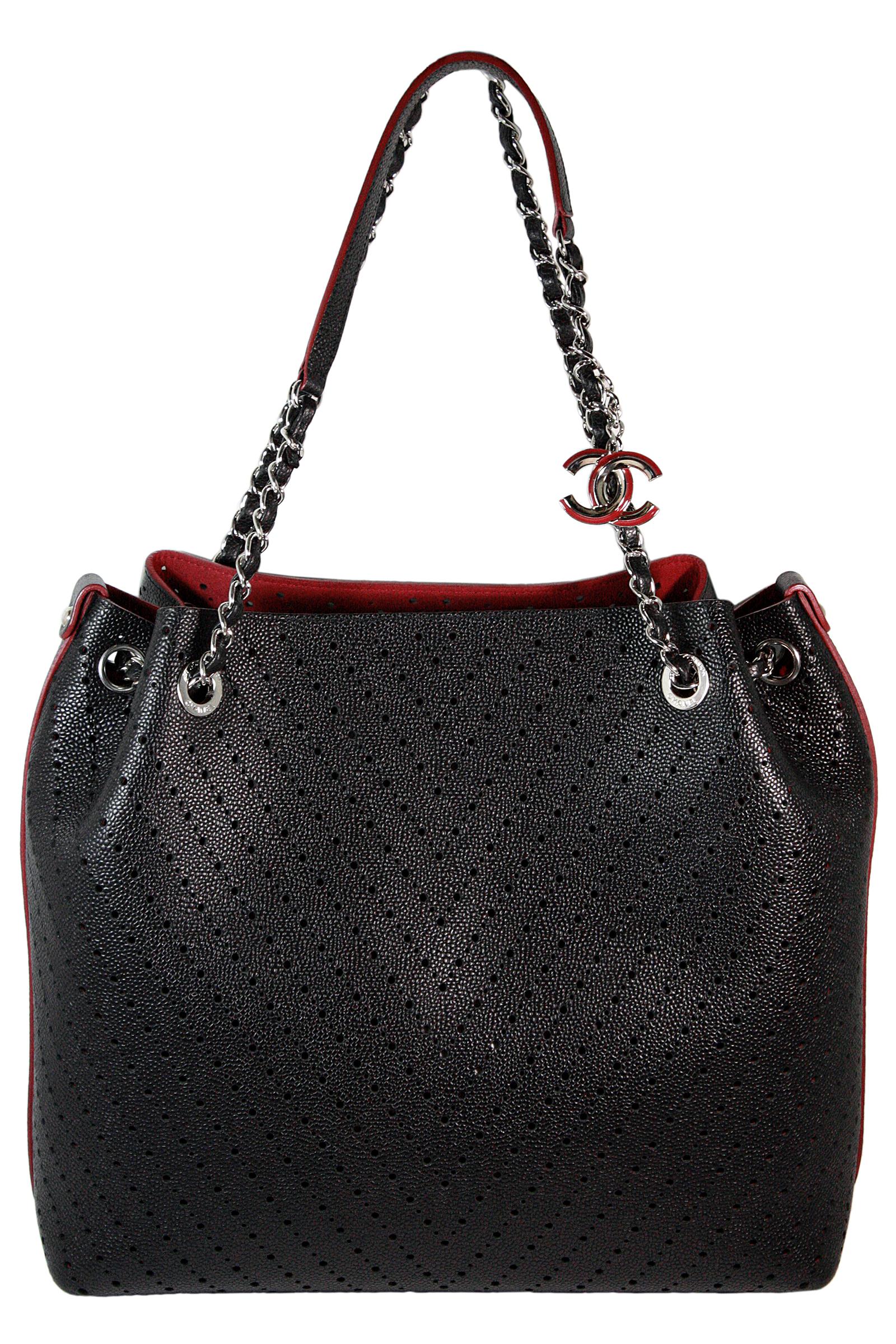 Large tote bag
Black textured leather with burgundy suede interior 
Attached enameled silver logo chain 
Iconic chain leather handle 
Small circular cutout leather design 
Maroon textured leather envelope clutch included 
Orignal box included
Made