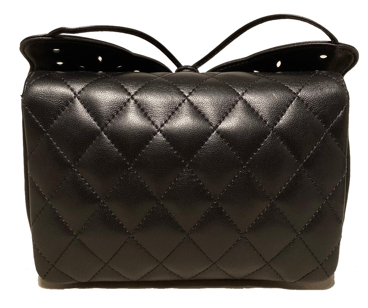 Chanel Black Leather Butterfly Mini Classic Flap Bag in excellent condition. Soft black lambskin exterior trimmed with a leather butterfly appliqué along front side and signature woven leather and silver chain shoulder strap. Front snap single flap