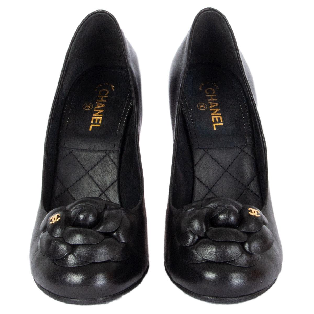 100% authentic Chanel CC Camelia pumps in black smooth leather featuring gold-tone CC logo on the flower. Brand new. Come with dust bag. Rubber sole has been added. 

Imprinted Size	38.5
Shoe Size	38.5
Inside Sole	25cm (9.8in)
Width	7.5cm