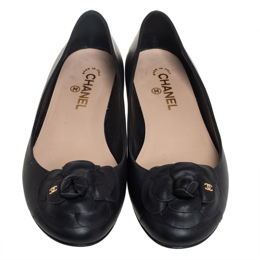 A common sight in the closets of fashionistas is a pair of Chanel ballet flats. They are perfect to wear on busy days and just stylish enough to assist one's style. These are crafted from black leather and feature the iconic Camellia motif on the