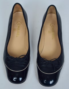 Pair of Chanel Black Cap-Toe Ballet Flats with Bow in Lambskin & Patent Leather