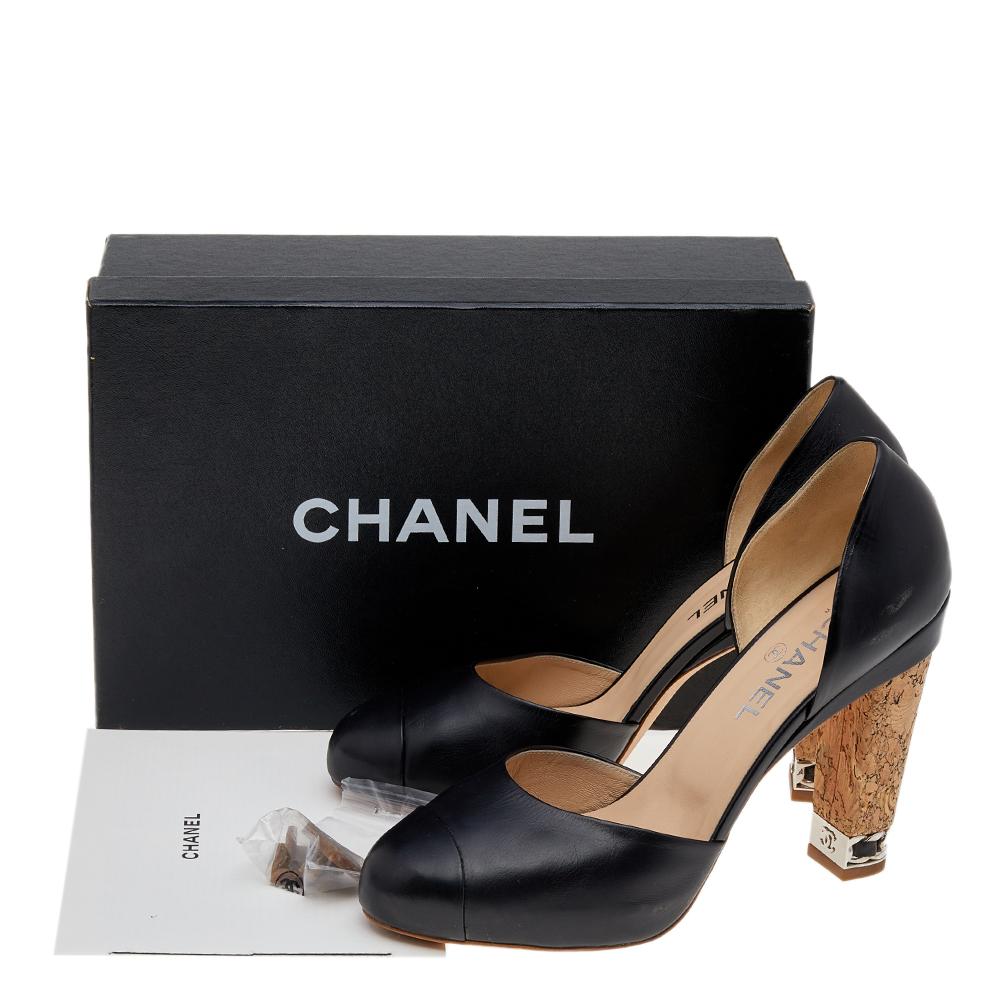 These D-orsay pumps from the House of Chanel bring unending glam and style to your feet. They are made using black leather on the exterior and feature cap toes, shapely counters, and block heels with embellishments. They are adorned with