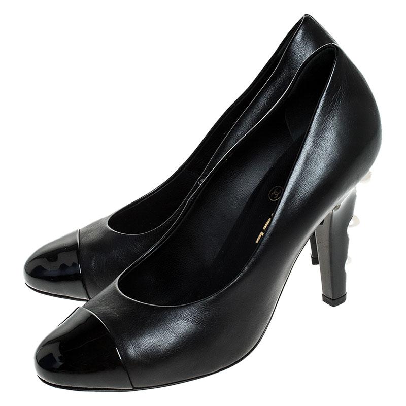In a magical blend of luxury and elegance, these pumps come crafted from black leather and designed with round cap toes and the faux pearls on the heels add the perfect finishing touch to the pair.

Includes: Original Dustbag

