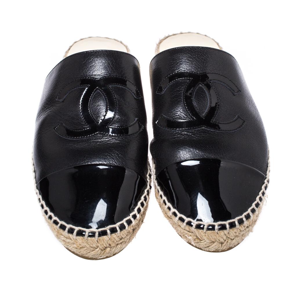 From Chanel comes this pair of mules that will exude luxury at each step. Crafted from leather, these black mules feature glossy cap toes, the CC logo on the uppers, and espadrille detailing. Chanel understands your need for comfort and style in