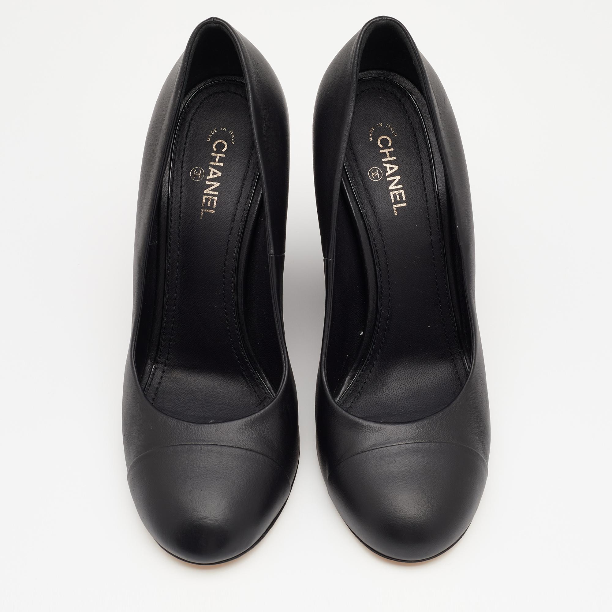 Walk stylishly in these classy pumps from the House of Chanel. Designed using black leather on the exterior, these pumps display wedge heels and rounded cap toes. They are finished with a slip-on style for ease. Match them with your formal dresses