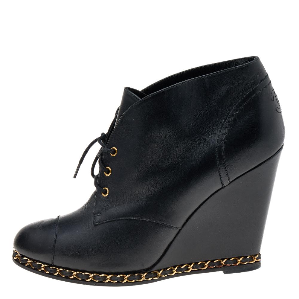 When it comes to the House of Chanel, rest assured that your fashion needs are all taken care of. These boots from Chanel exude charm with saving grace! They are designed using black leather into an ankle-length silhouette. They show CC chain