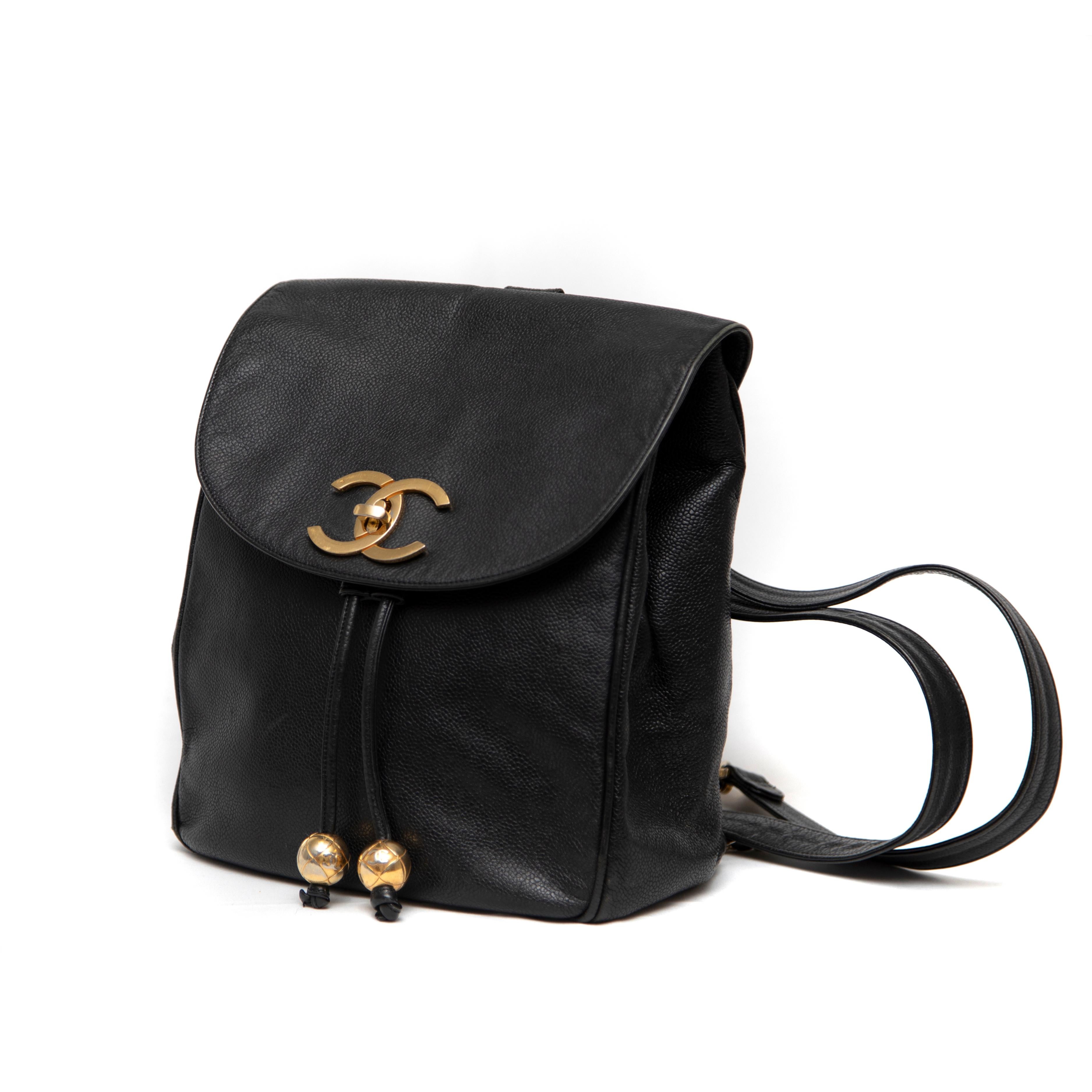 The Chanel Black Leather CC Drawstring Backpack is a chic and functional accessory that perfectly blends luxury with practicality. Crafted from premium black leather, this backpack showcases the iconic Chanel craftsmanship, featuring a soft yet