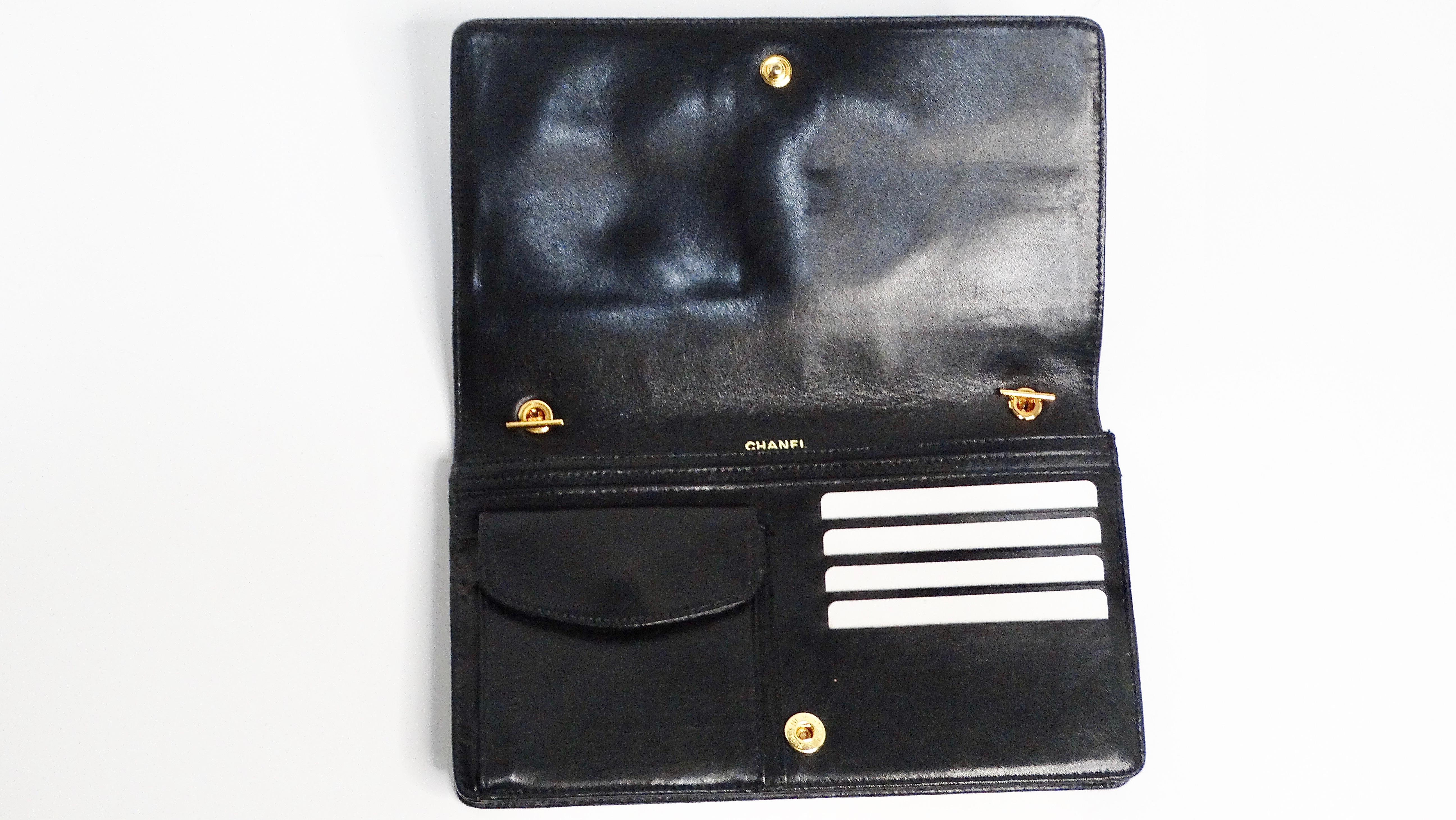The Chanel Black Leather CC Embossed Crossbody Wallet on Chain circa 1996-97 is the epitome of timeless elegance and practicality. Crafted from black leather, this sleek crossbody bag features the iconic CC logo embossed subtly on the front, making