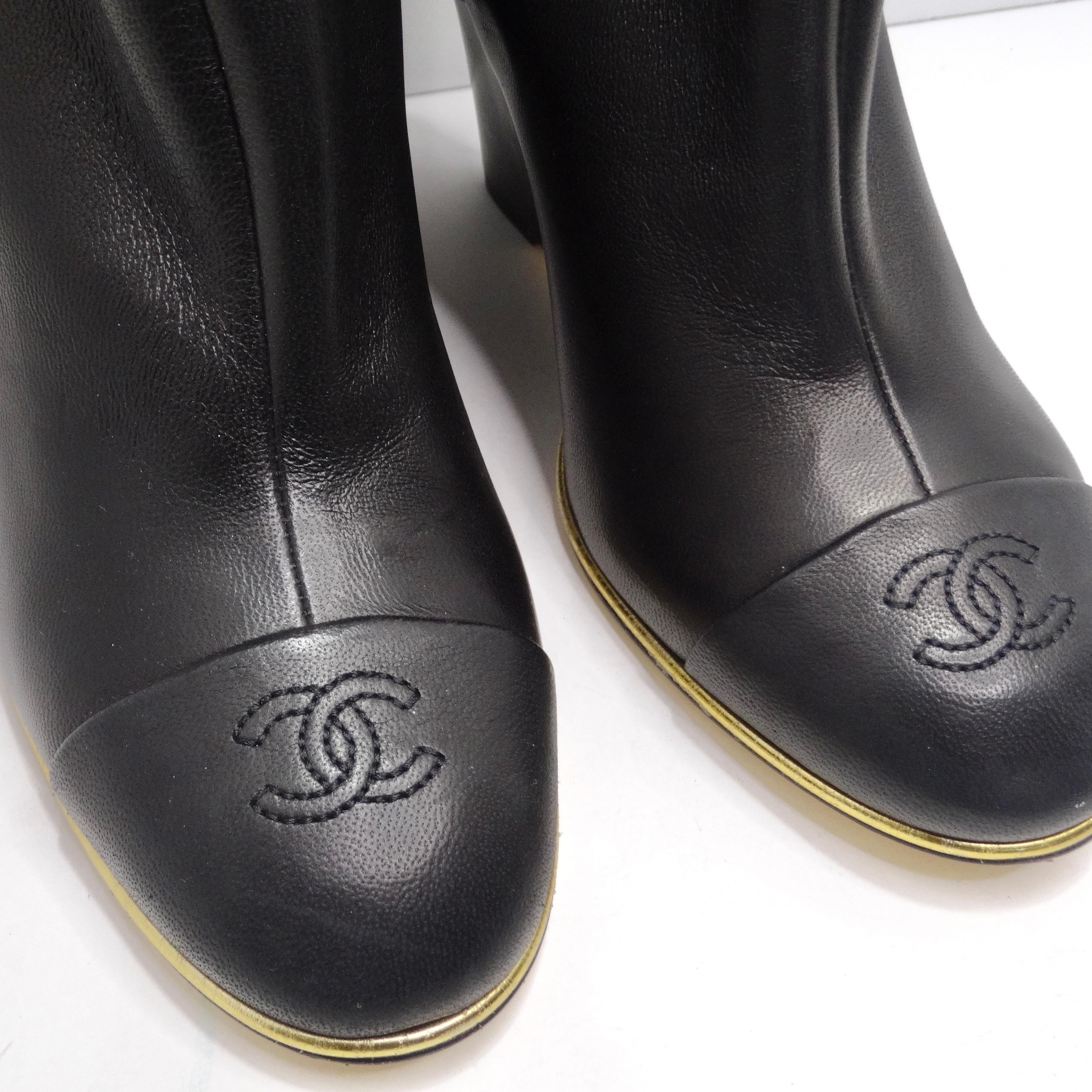 Introducing the Chanel Black Leather CC Over The Knee Wedge Boots – the epitome of luxury and edgy style. These boots are more than just footwear; they are a bold fashion statement that exudes sophistication. The signature Chanel interlocking 'C'