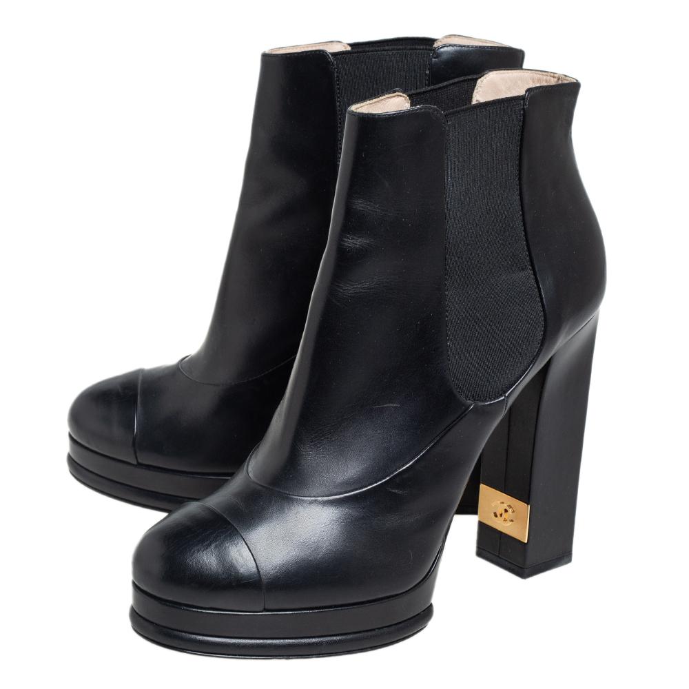 Get set to impress wherever you go with these Chelsea boots from Chanel. These lovely black beauties are crafted from leather and feature platforms, cap toes, and the CC logo on the 13 cm block heels. The boots are complete with leather soles.

