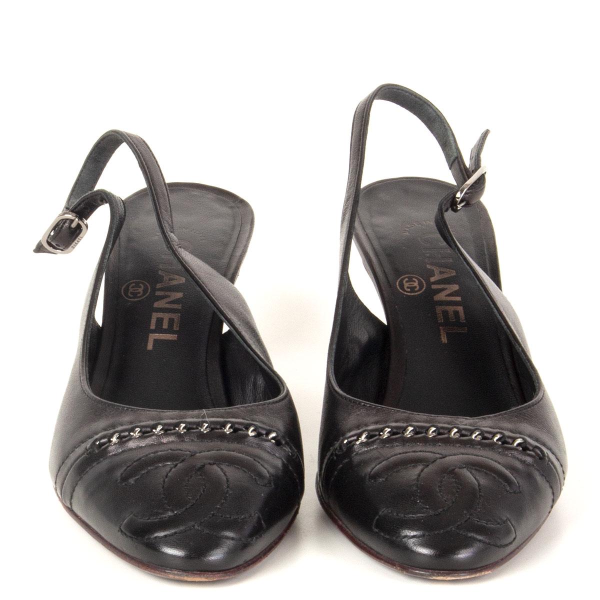 authentic Chanel slingbacks in black calfskin with silver-tone chain detail and CC stitching on the tip. Have been worn and are in excellent condition. 

Imprinted Size 37
Shoe Size 37
Inside Sole 24cm (9.4in)
Width 7.5cm (2.9in)
Heel 7cm (2.7in)
