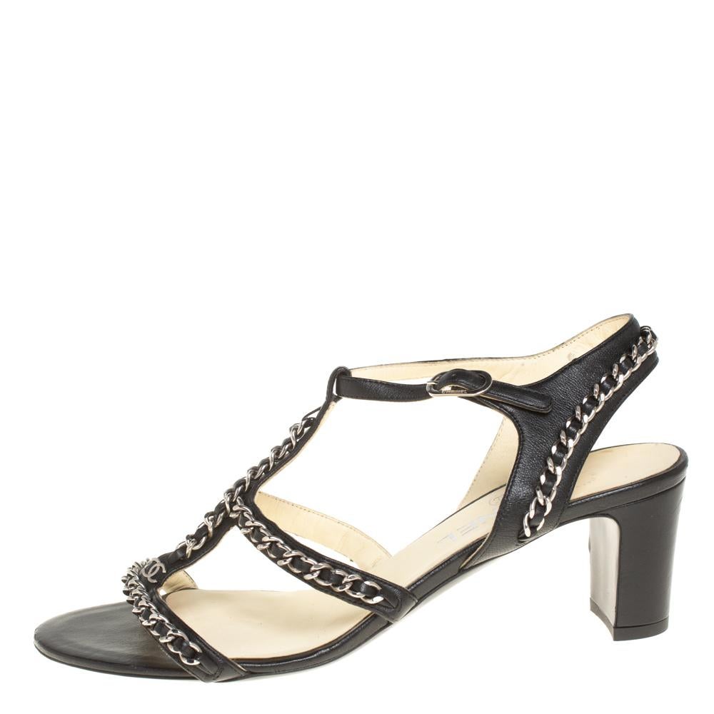 You'll truly be in love with these sandals from Chanel as they are stylish and modern. They flaunt straps decorated with signature interweaved chains, buckle ankle fastenings, and the CC logo on the frontal strap. The sandals are elevated on 6.5 cm
