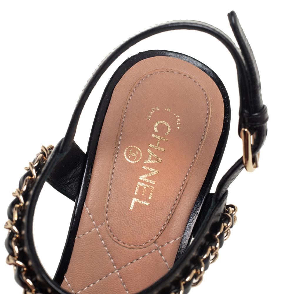 Bring in the subtle glamour to your outfits with this pair of sandals from Chanel. They have been crafted from leather and styled with slender straps at the front and ankles both accented with interwoven chain details. These sandals come with