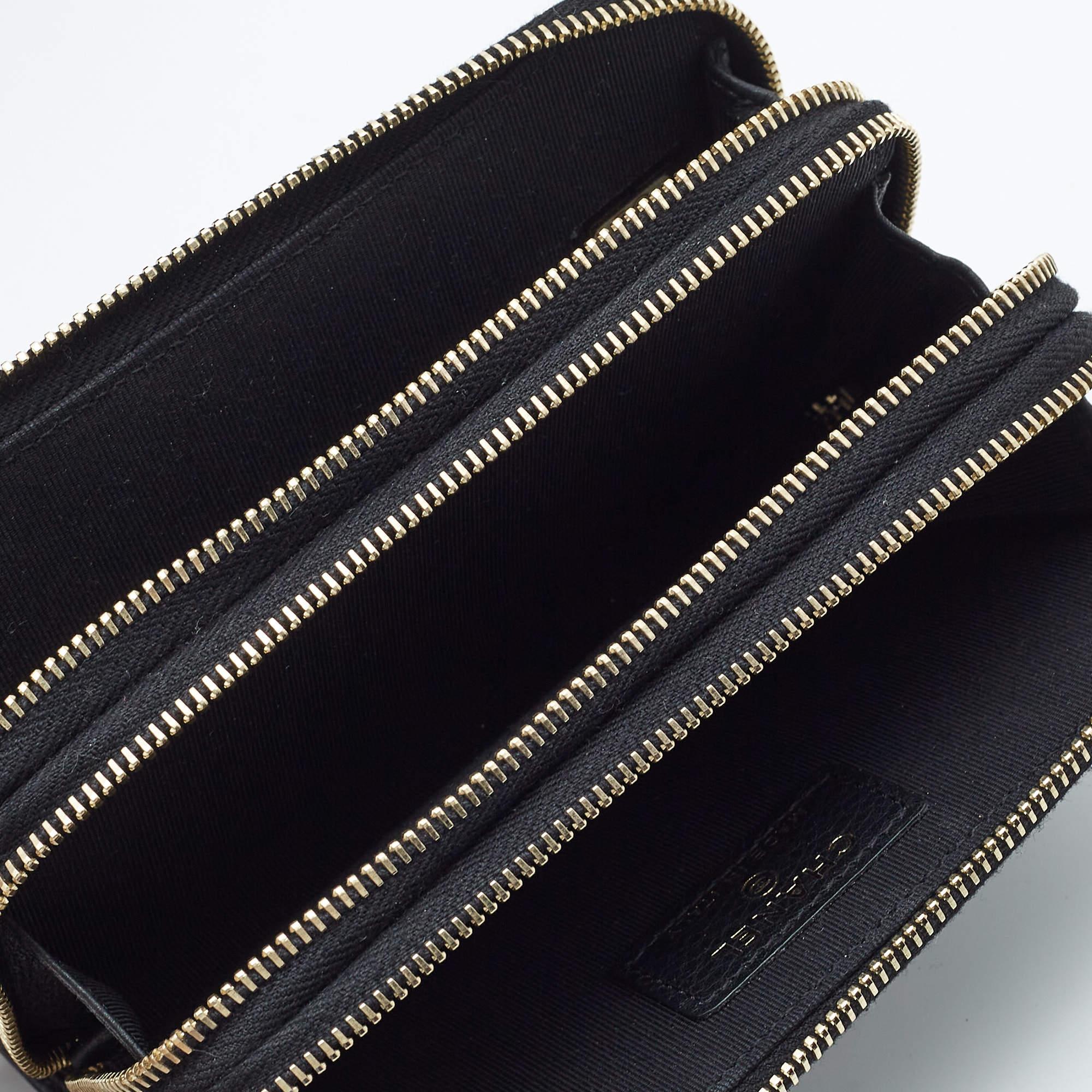 Experience luxury with the Chanel phone holder. Crafted from premium black leather this exquisite accessory is adorned with sparkling crystals creating a striking design. The holder combines practicality with high fashion providing secure storage