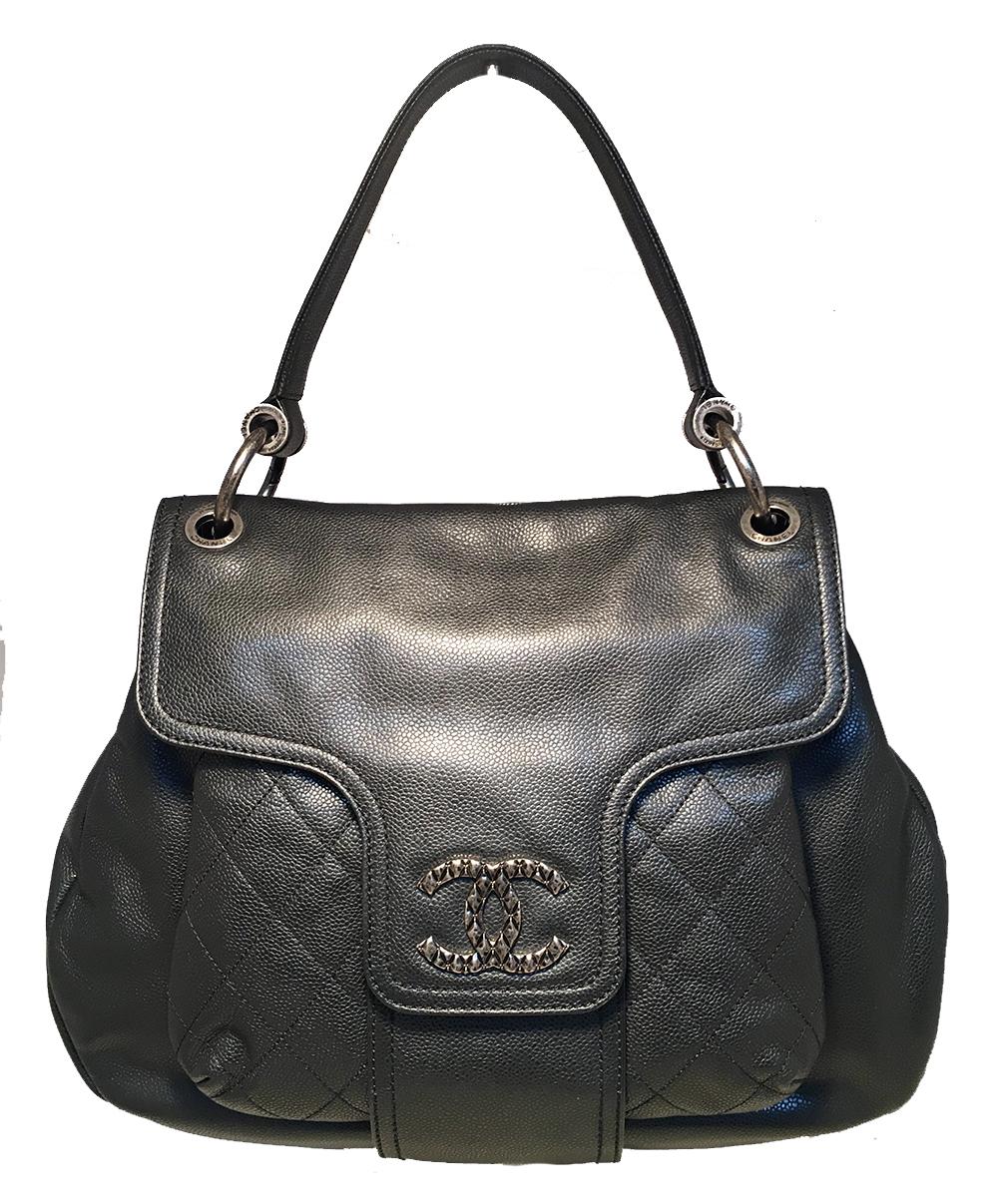 Chanel Black Leather Coco Rider Flap Bag in excellent condition. Black glazed caviar leather exterior trimmed with antiqued silver hardware. Unique double shoulder strap design features one full leather strap and one longer woven chain and leather