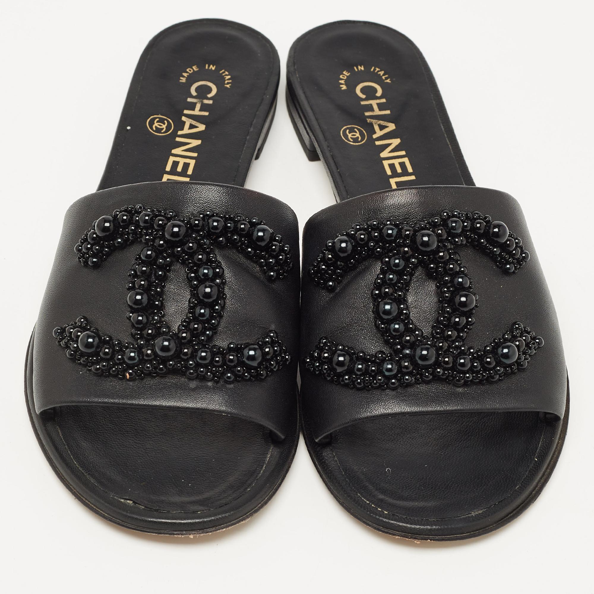 Enhance your casual looks with a touch of high style with these Chanel slides. Rendered in quality material with a lovely hue adorning its expanse, this pair is a must-have!

Includes: Original Dustbag, Original Box, Info Booklet

