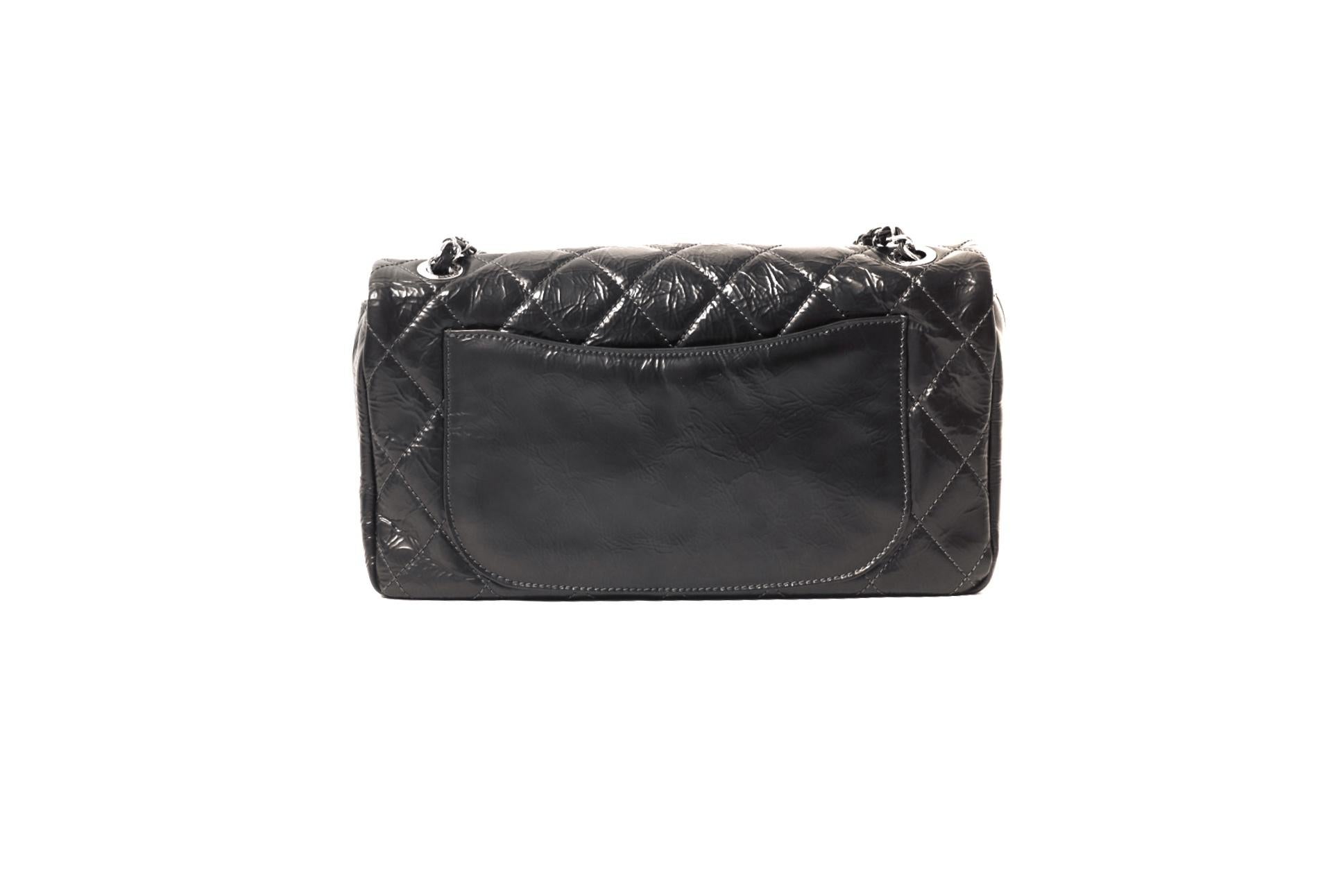 This authentic Chanel Black Leather Flap Bag is in pristine condition.  Perfectly scaled for year-round daily enjoyment, it is an excellent addition to any collection.
Black glazed leather has an intentionally distressed finish and is quilted in