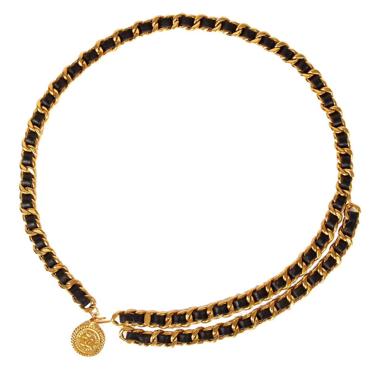 Chanel chain belt in gold-tone metal and black leather featuring CC coin charm. belt is adjustable and fits all sizes. Has been worn and is in excellent condition. Comes with dust bag. 

Width 1.5cm (0.6in)
Length 94cm (36.7in)
Hardware Gold-Tone