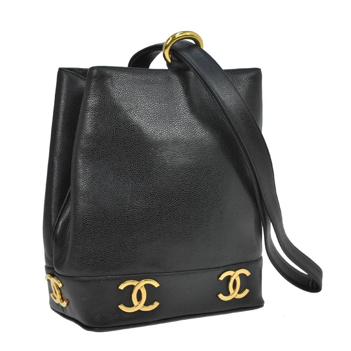 Chanel Black Leather Gold Charms Sling Back Carryall Duffle Shoulder Bag

Caviar leather
Gold tone hardware
Date code present 
Made in Italy
Shoulder strap drop 18